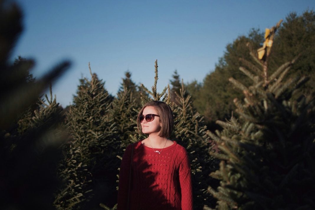 woman trees sun winter