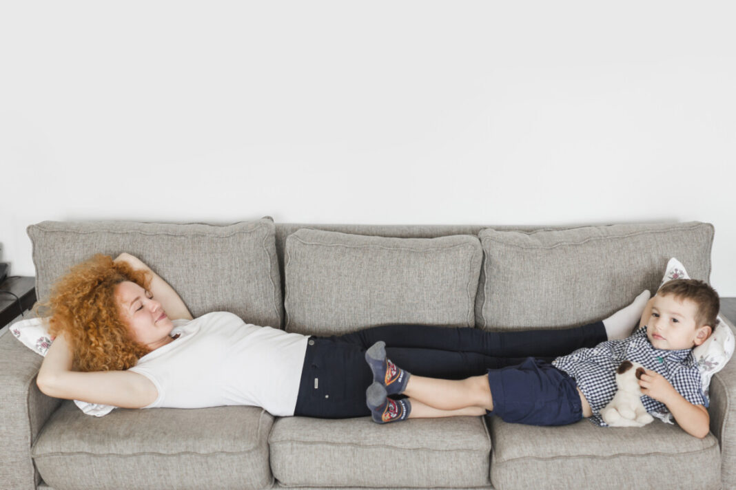 mother-her-son-lying-sofa