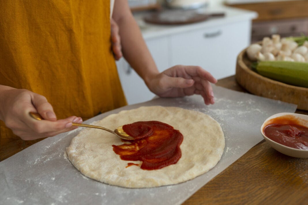 side-view-cook-preparing-pizza
