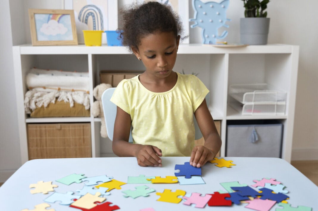 front-view-girl-making-puzzle-table